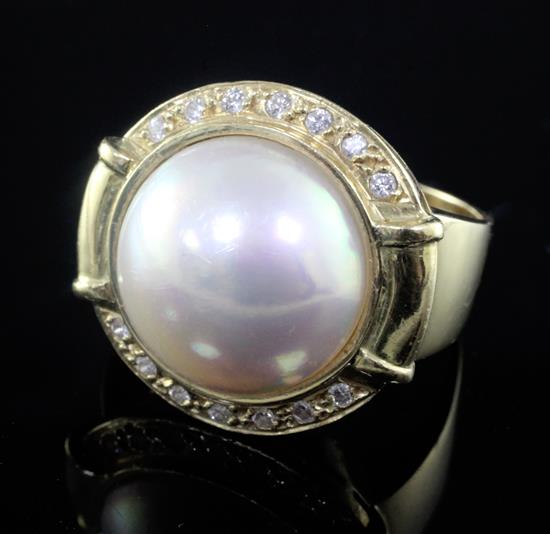 A modern 14ct gold, mabe pearl and diamond set dress ring, size T.
